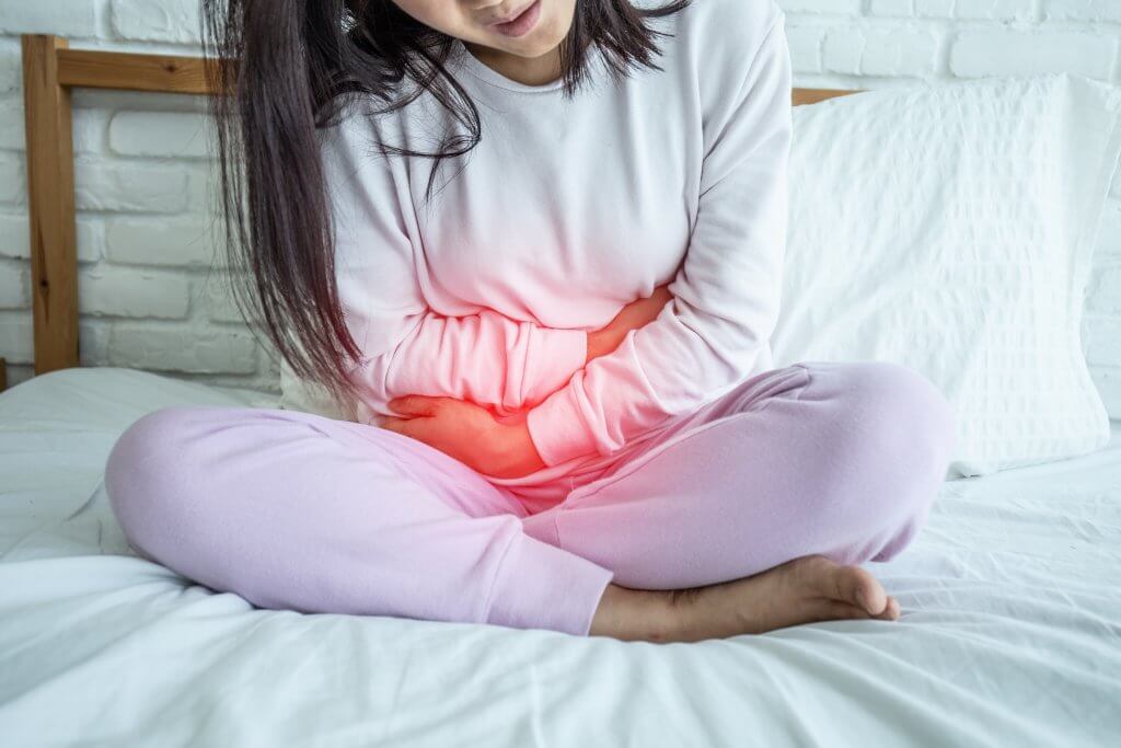 woman have bladder pain sitting on bed in bedroom after wake up feeling so sick and painful,Healthcare concept; blog: is there a cure for ibs?