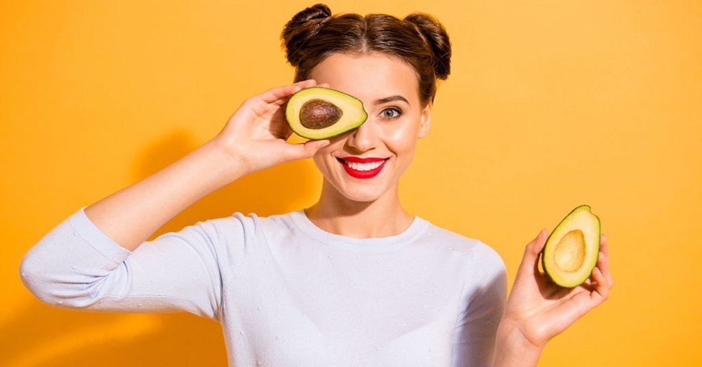 Close up photo beautiful she her lady pretty hairdo hold slices avocado hide eye used amazing salon mask oil extract procedure wearing casual white pullover clothes isolated yellow background; blog: 6 Digestive Superfoods and their Benefits