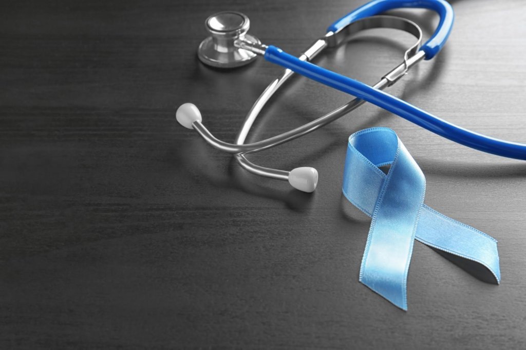 a blue ribbon and a stethoscope to represent colorectal cancer awareness month