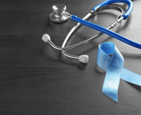 a blue ribbon and a stethoscope to represent colorectal cancer awareness month