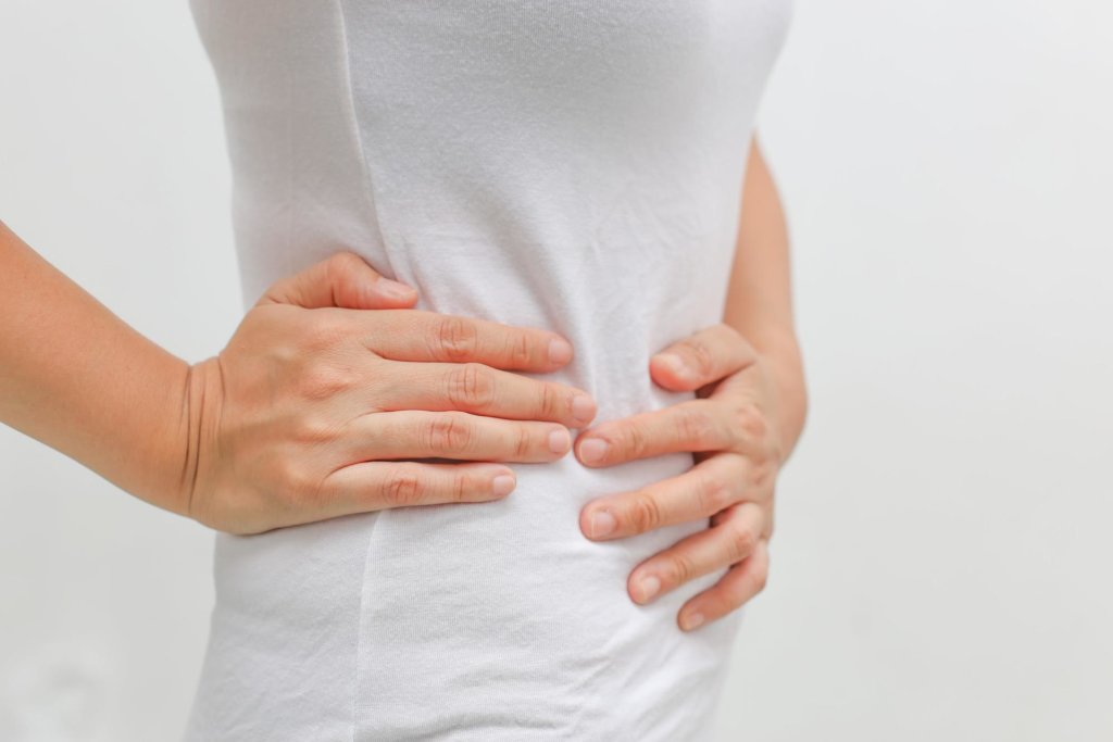 A woman suffering from gastrointestinal issues